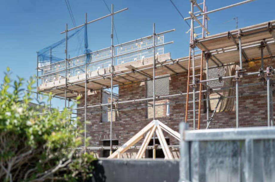 House extension under construction with scaffolding